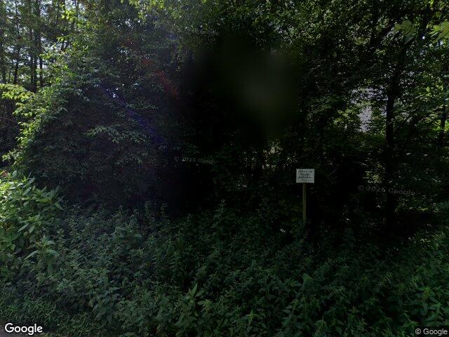 Zwangsversteigerung: einseitig angebautes Einfamilienhaus als Flachdachbungalow mit Garage in Bergisch Gladbach, Herkenrath